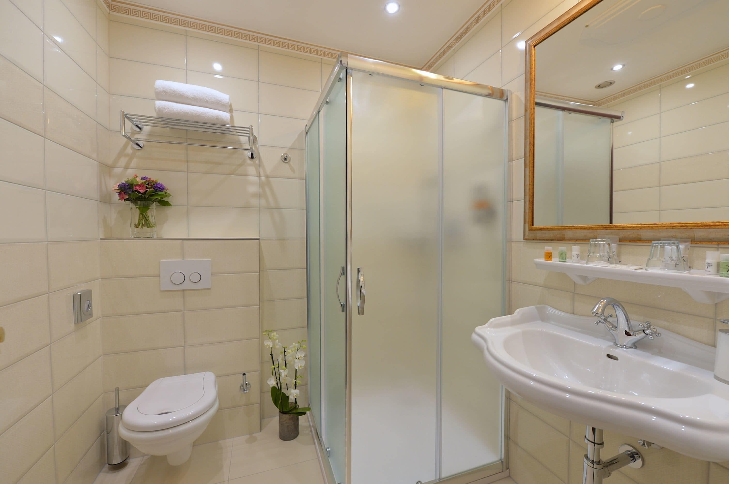 designer toiletries, hair dryer, bathrobes, towels