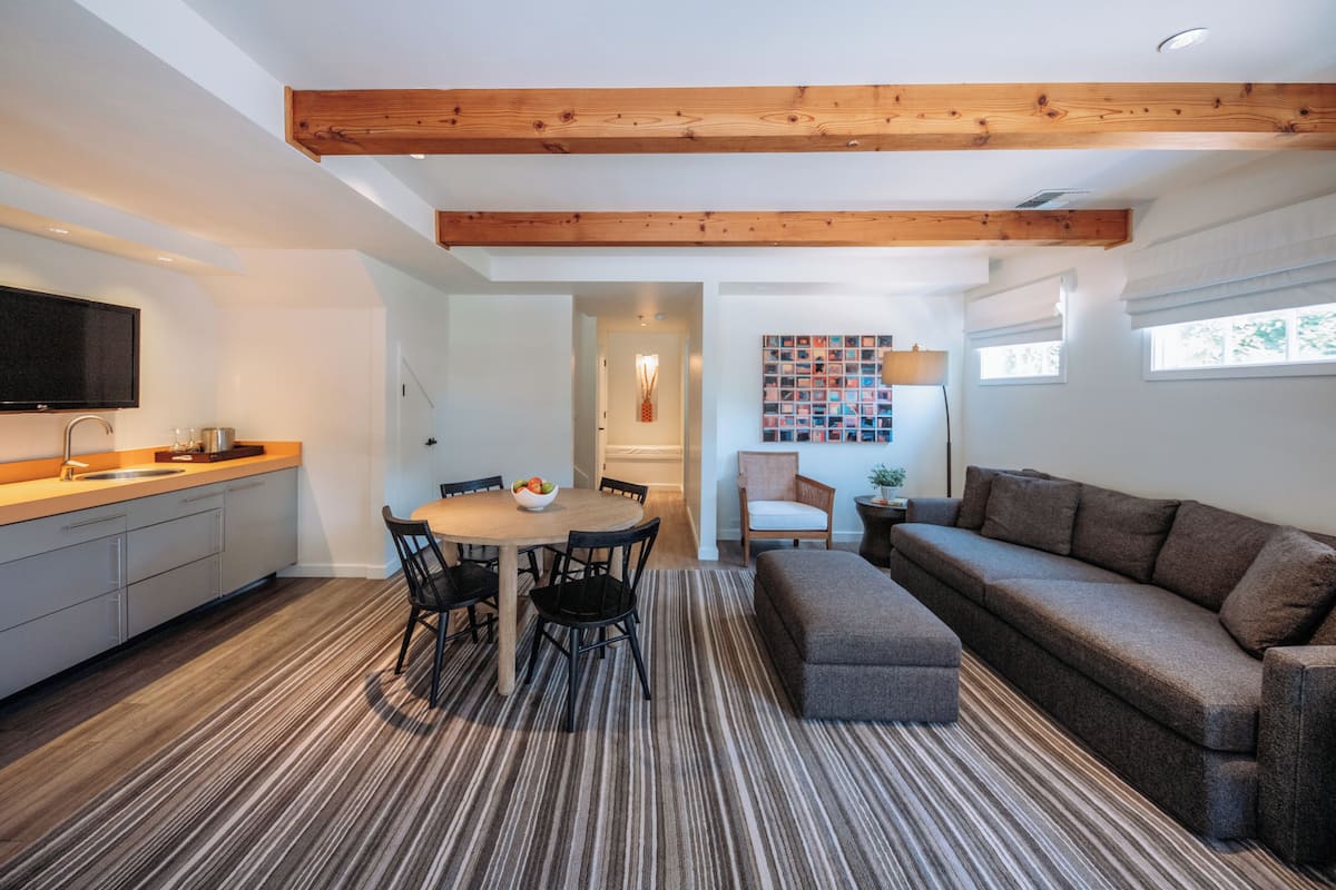 A modern interior with a kitchen, dining area, and living space.