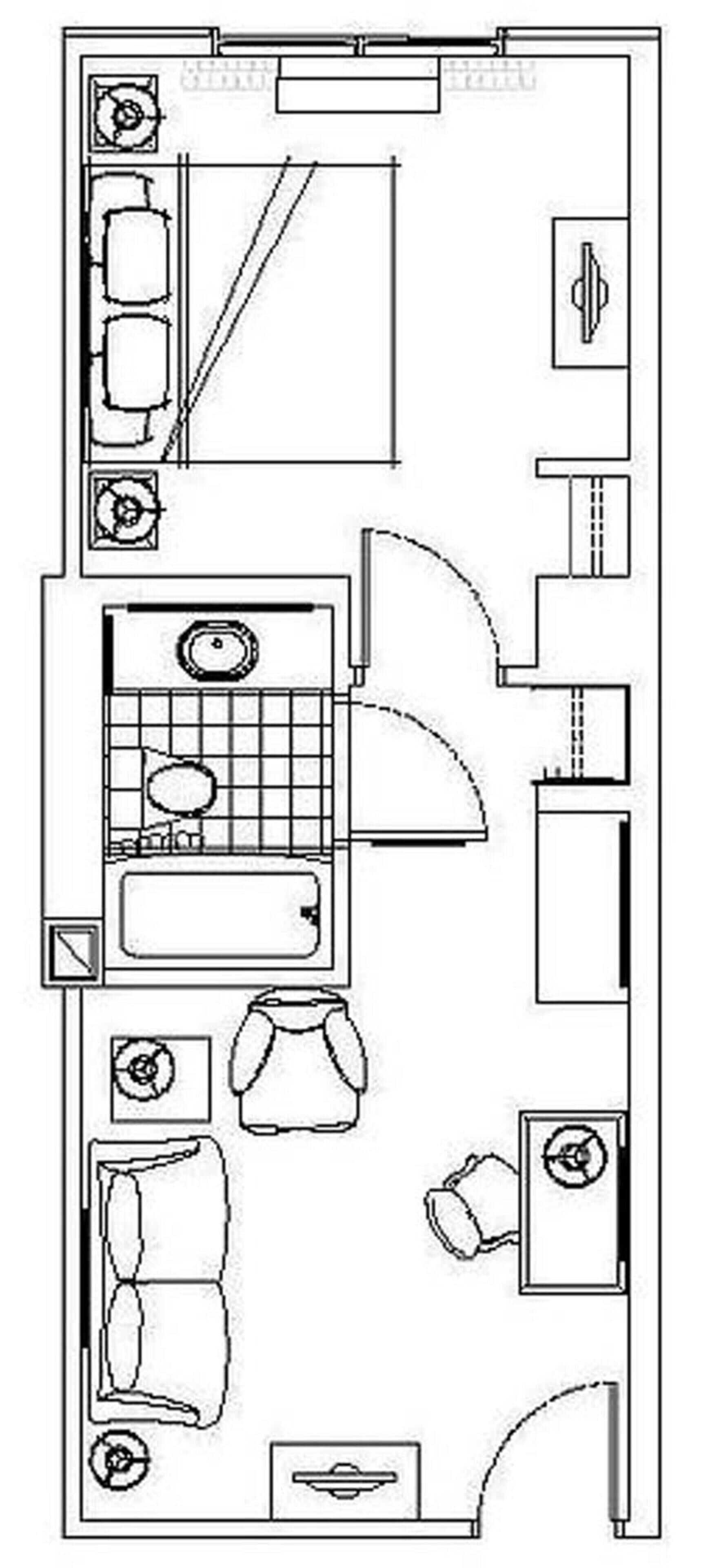 A hotel room layout with a bed, a desk, a chair, a small table, and a sofa.