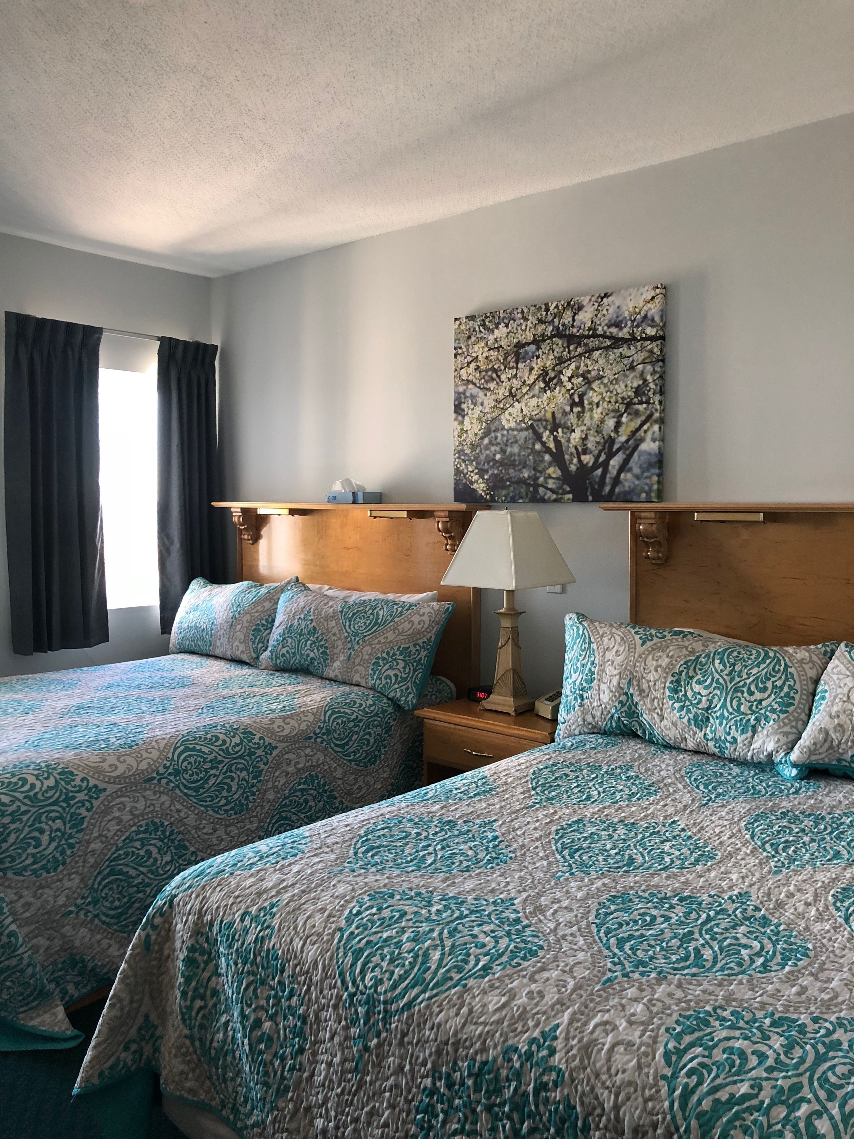 deluxe room, 2 queen beds, balcony, ocean view | 1 bedroom, premium bedding, individually decorated