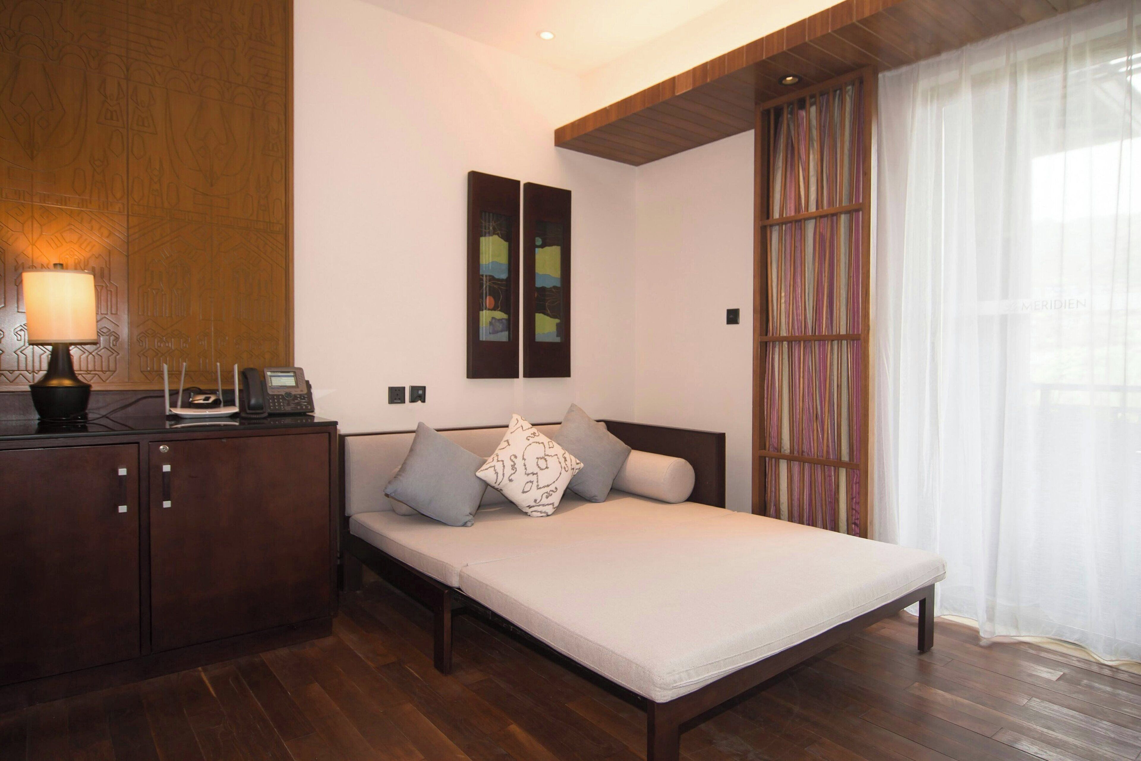 premium family room, guest room, 1 king, sofa bed, garden view, balcony | 1 bedroom, select comfort beds, minibar, in-room safe