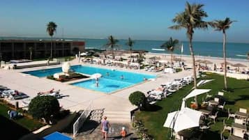 Outdoor pool, pool umbrellas, sun loungers