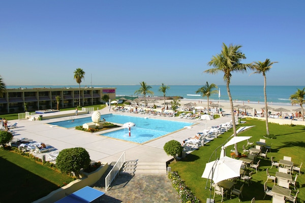 Outdoor pool, pool umbrellas, sun loungers