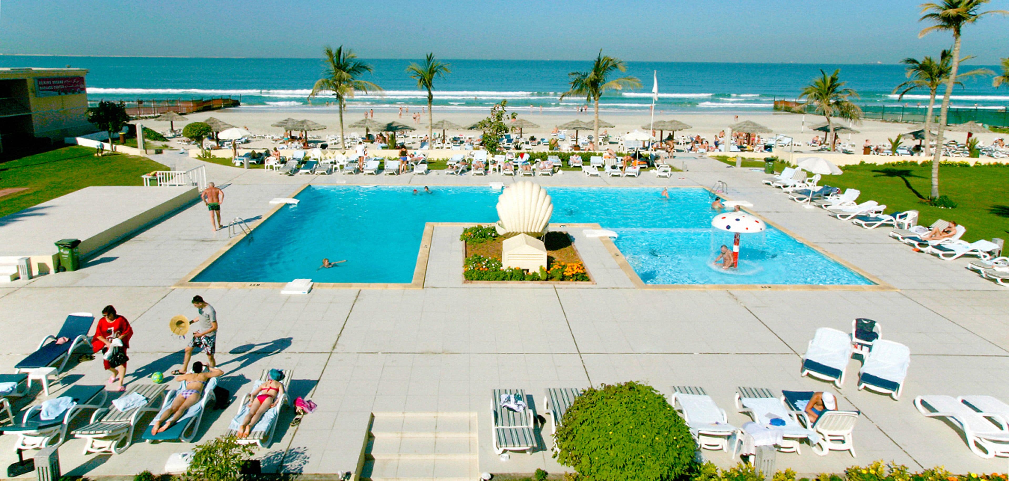 Outdoor pool, pool umbrellas, sun loungers