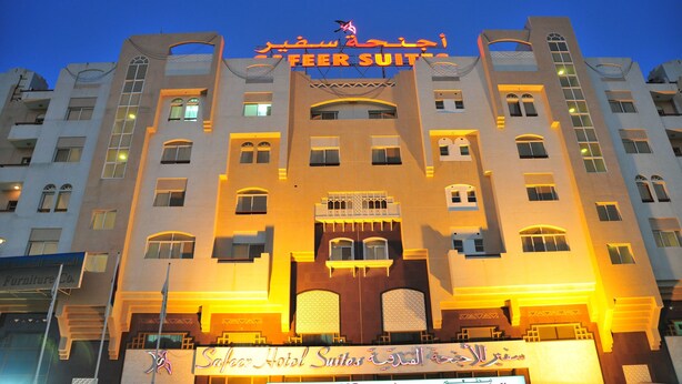 A hotel with a prominent sign reading "FEER SUIT" and "Hotel Suites". - Safeer Hotel Suites - Aparthotel (Muscat)