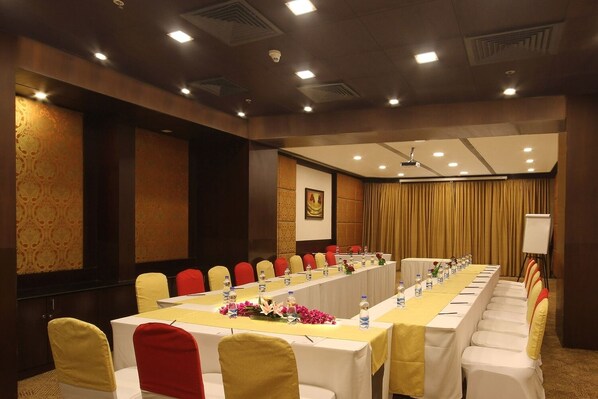 A conference room with a long table, rows of chairs, and a whiteboard. - Fortune Select JP Cosmos, Bengaluru - Member ITC Hotels' Group (Bengaluru)