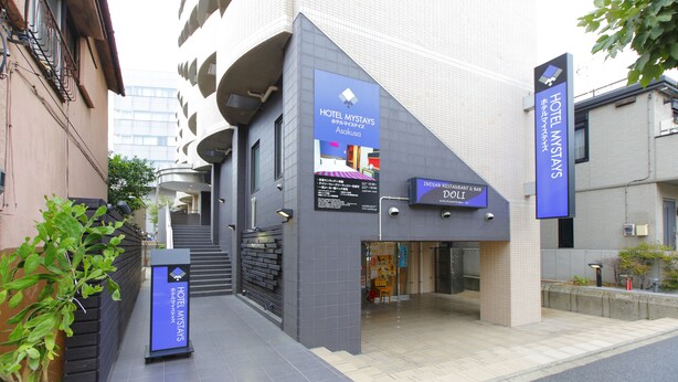 A modern hotel entrance with a sign for Hotel Mystays Asakusa, featuring a restaurant and bar named Indian Restaurant & Bar. - Hotel MyStays Asakusa (Tokyo)