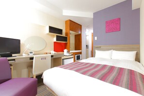A hotel room with a bed, a desk with a computer, a television, a chair, and a microwave. - Hotel MyStays Asakusa (Tokyo)