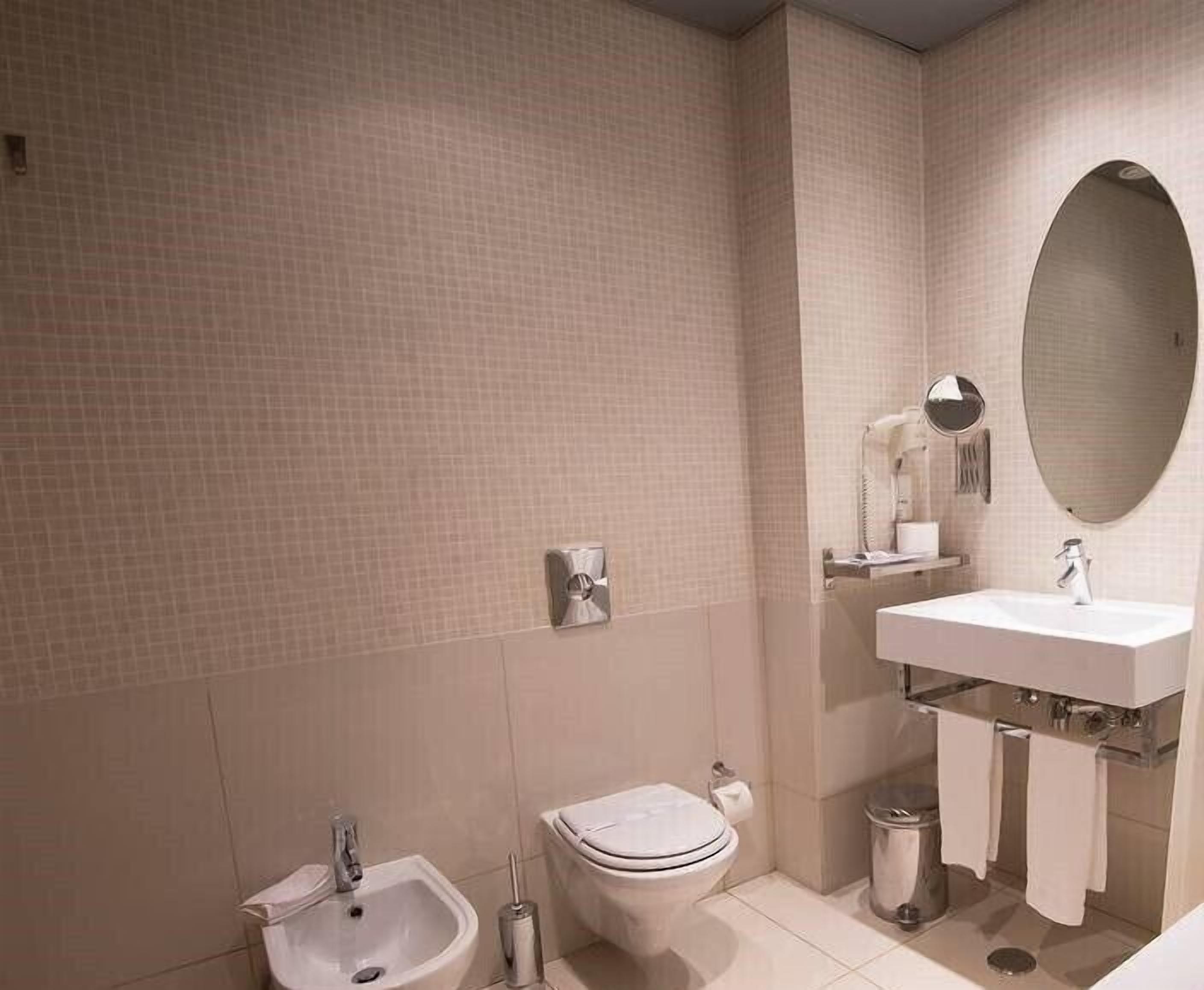 bathtub, free toiletries, hair dryer, slippers