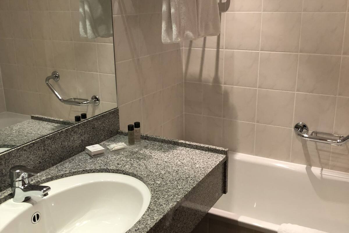 eco-friendly toiletries, hair dryer, towels