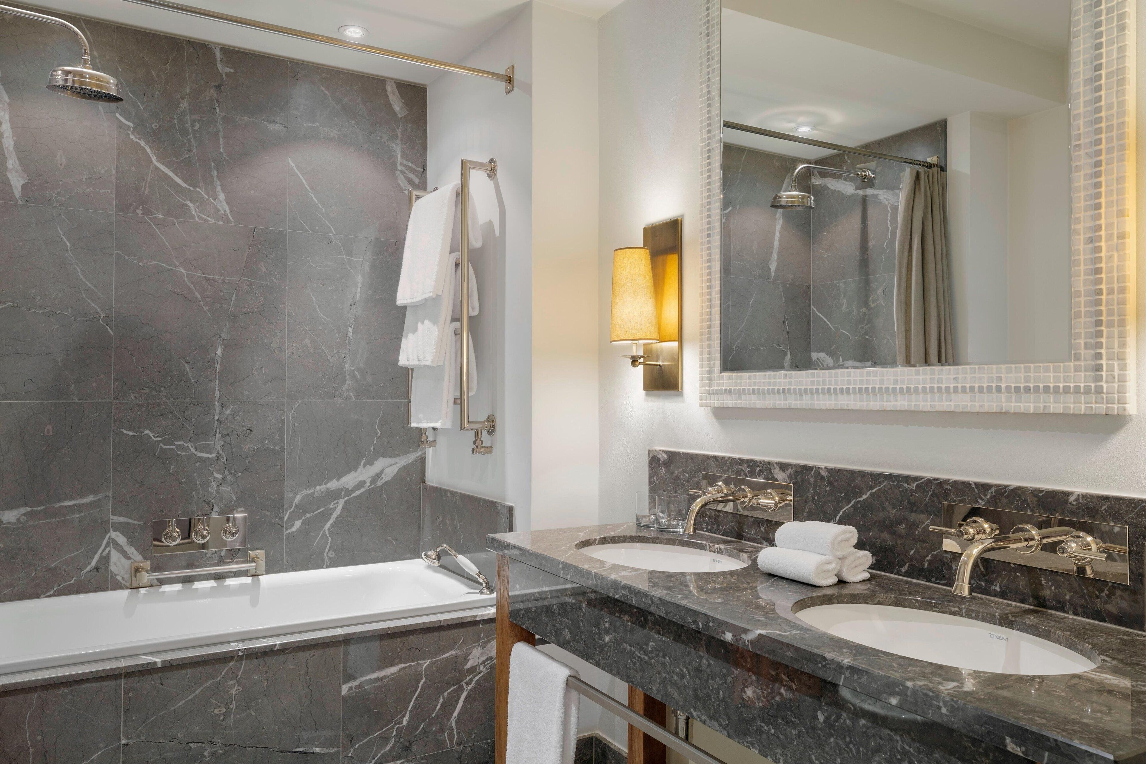 combined shower/bathtub, rainfall showerhead, designer toiletries