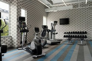 A gym with treadmills, elliptical machines, and dumbbells. - Aloft by Marriott Richmond West Short Pump (Richmond)