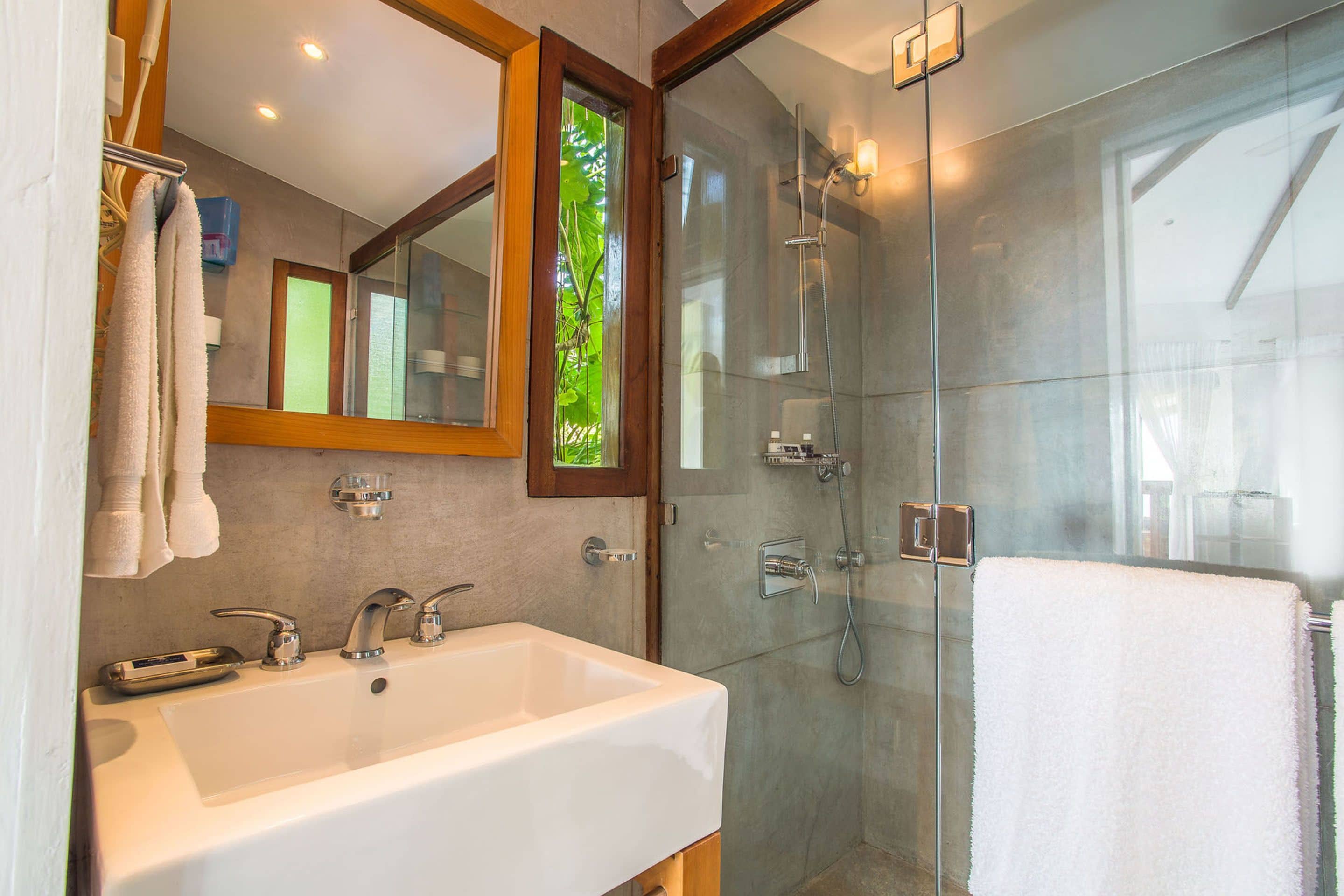 deluxe room, 1 queen bed, ocean view | bathroom | shower, free toiletries, hair dryer, bathrobes