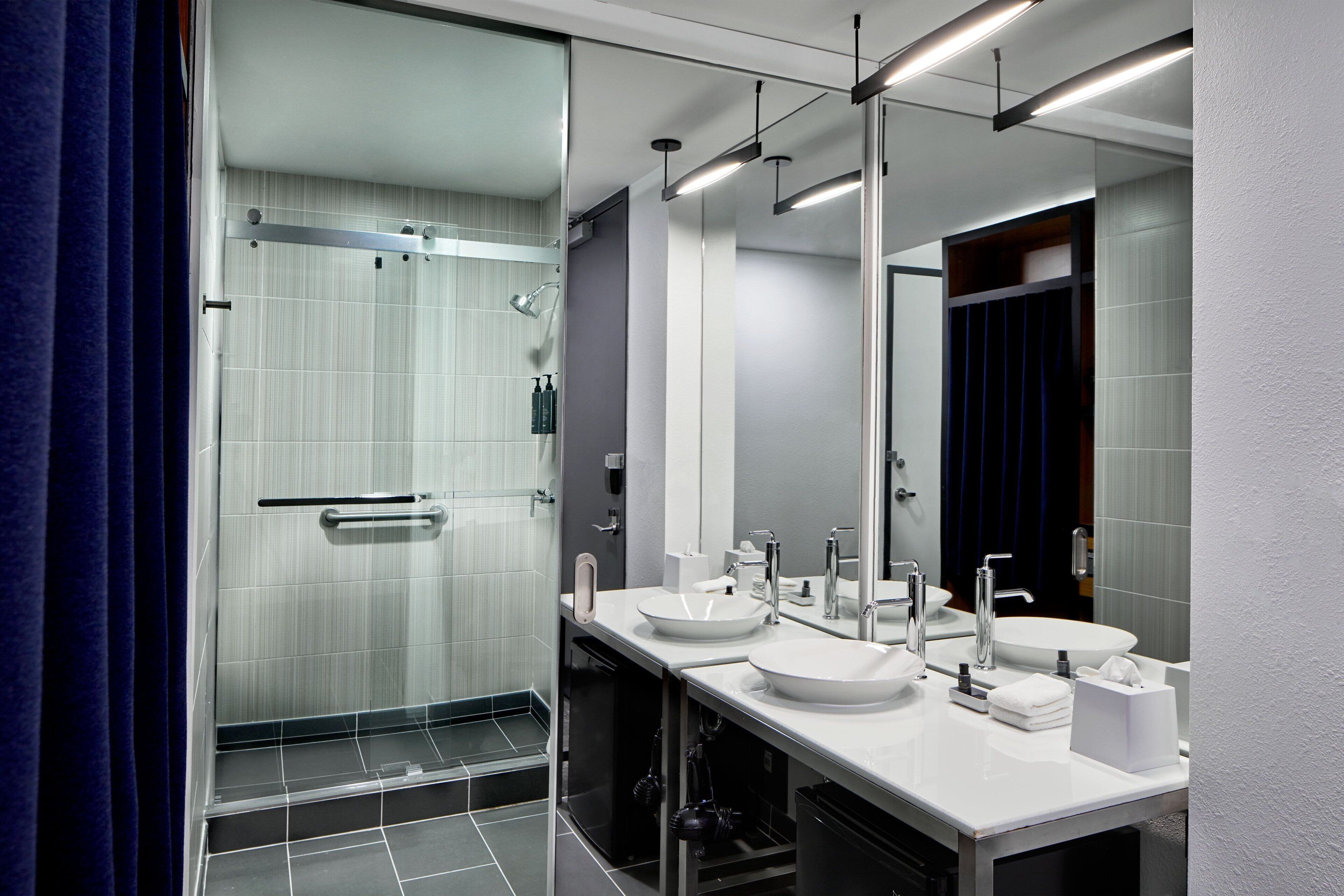 designer toiletries, hair dryer, towels