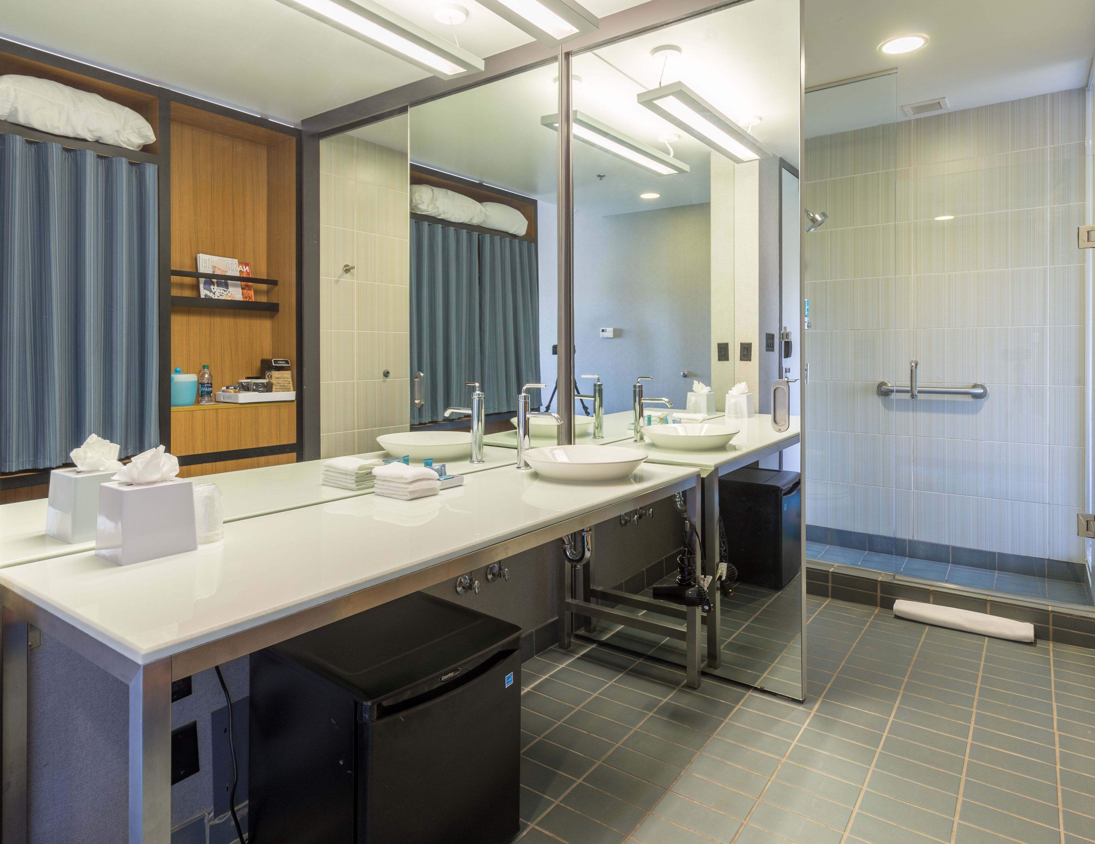 designer toiletries, hair dryer, towels