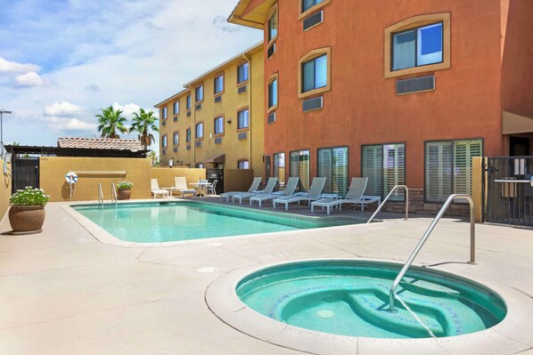 Outdoor pool, open 6 AM to 10 PM, pool umbrellas, pool loungers