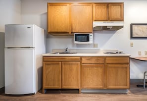 Full-sized fridge, microwave, stovetop, freezer