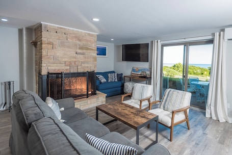 Suite, 1 Bedroom, Fireplace | Living area | TV. Beachcomber Resort at Montauk