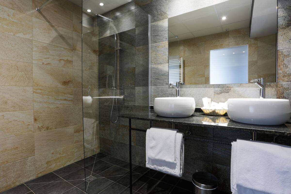 eco-friendly toiletries, hair dryer, bathrobes, slippers