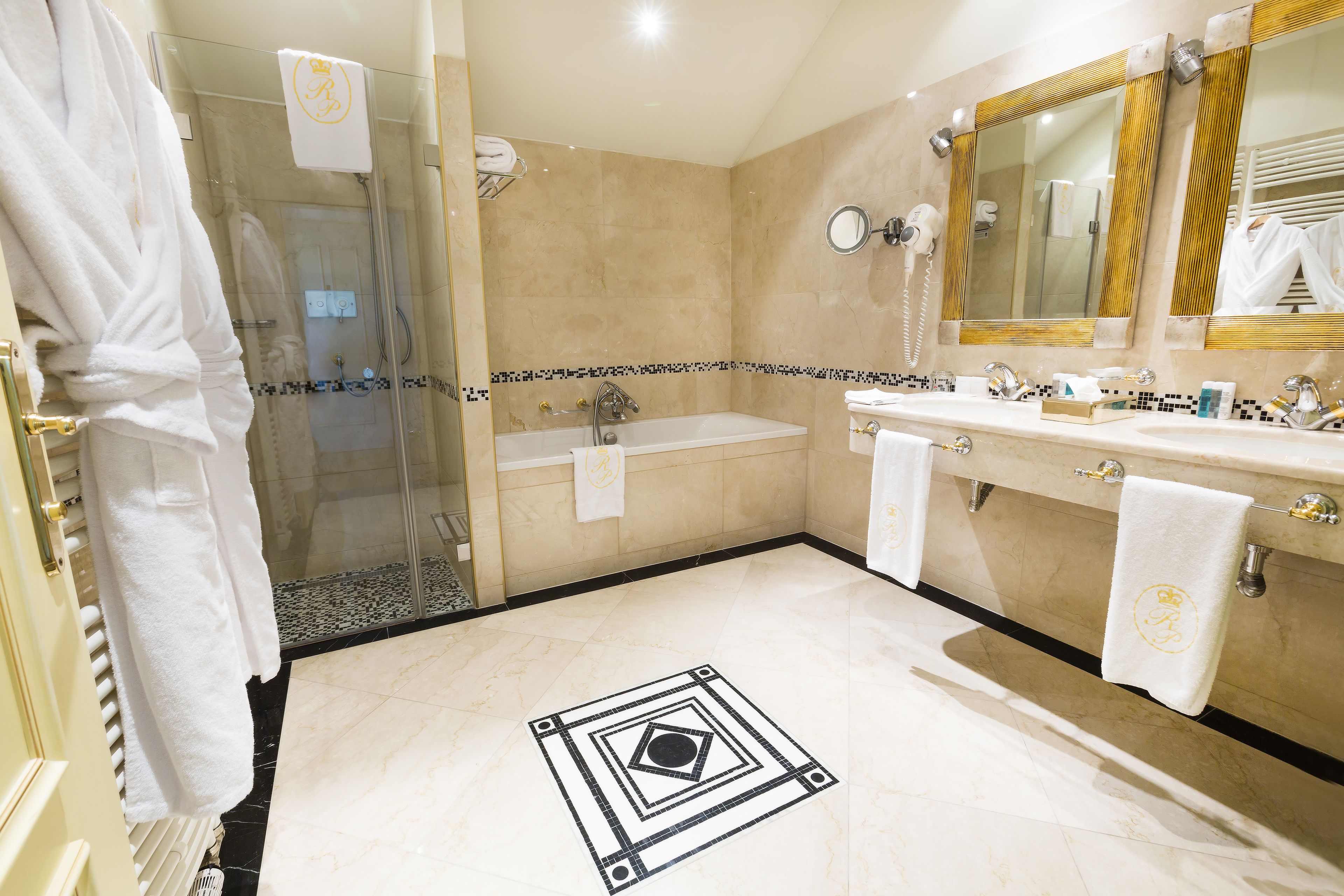 combined shower/bathtub, designer toiletries, hair dryer, bathrobes