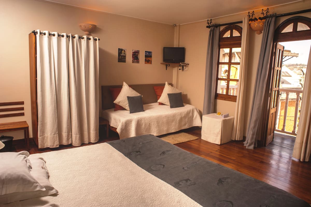 Family Room | Minibar, in-room safe, individually decorated, blackout curtains