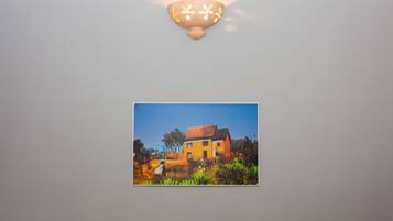 A wall-mounted light fixture with a decorative design.