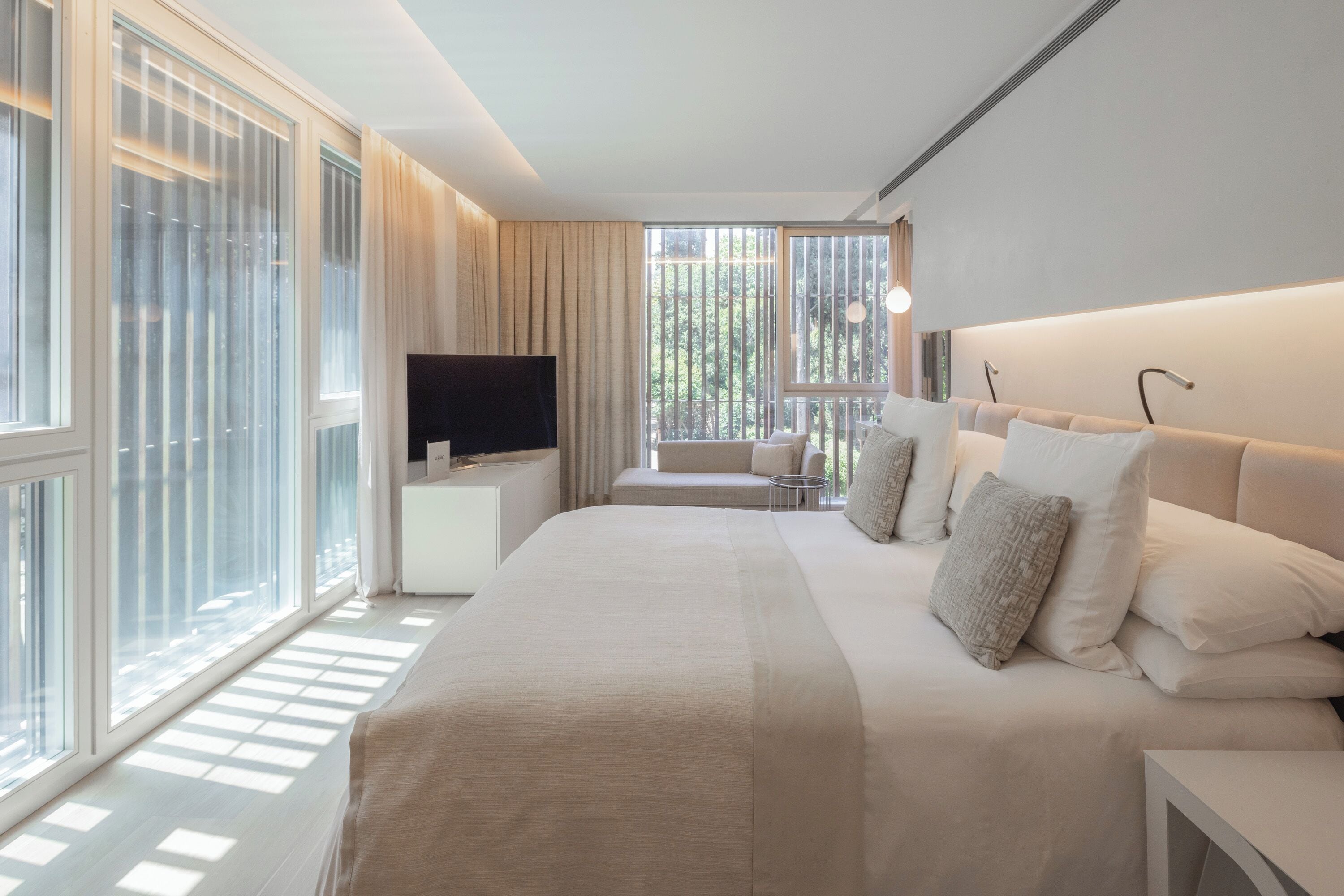 Premium bedding, down comforters, pillowtop beds, minibar