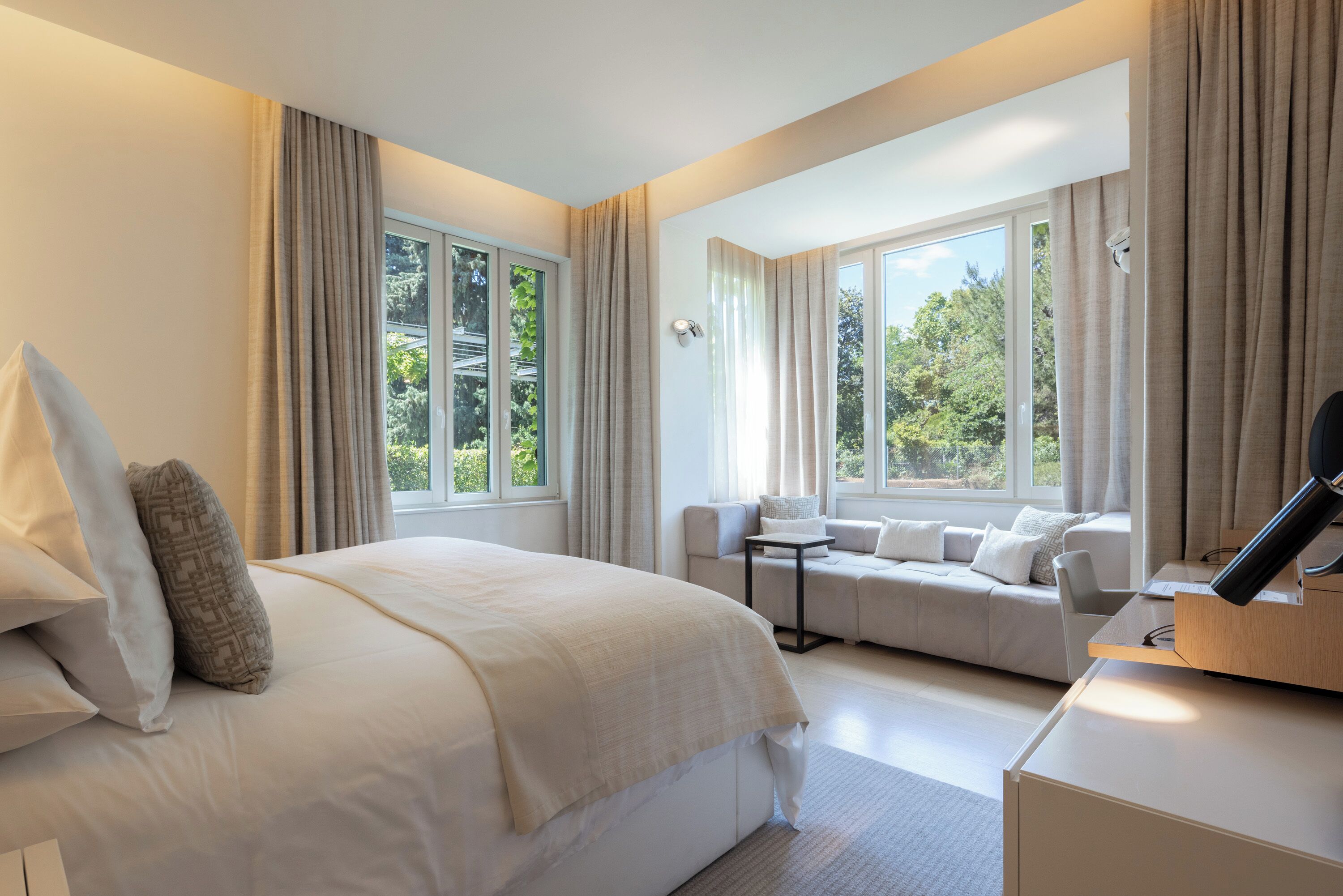 Premium bedding, down comforters, pillowtop beds, minibar