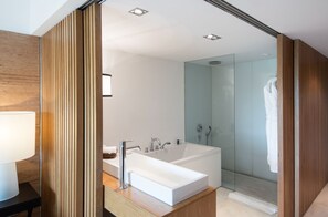 Separate tub and shower, rainfall showerhead, free toiletries