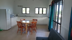 Deluxe Two-Bedroom Apartment | Private kitchenette | Full-size fridge, microwave, stovetop, coffee/tea maker