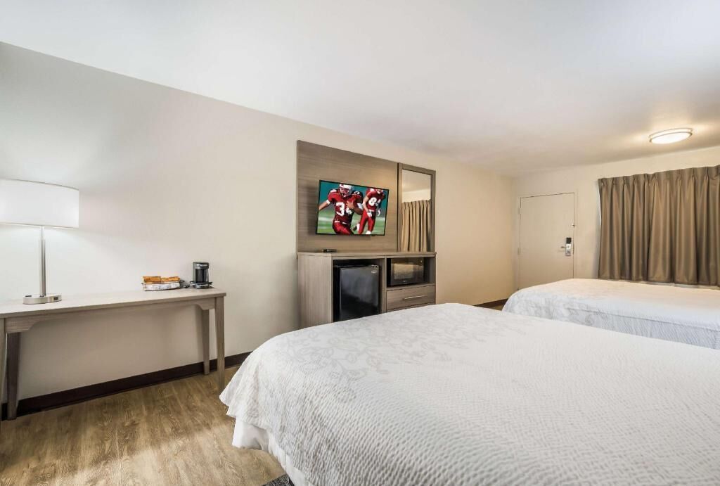 Premium bedding, blackout drapes, iron/ironing board