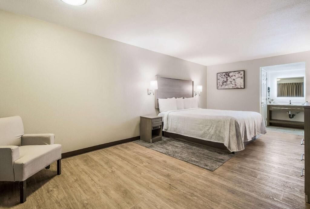 Premium bedding, blackout drapes, iron/ironing board