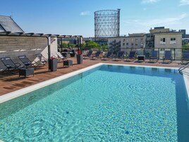 Seasonal outdoor pool, open 10:00 AM to 7:30 PM, pool loungers