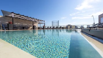 Seasonal outdoor pool, pool loungers