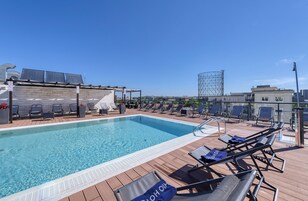 Seasonal outdoor pool, open 10:00 AM to 7:30 PM, pool loungers