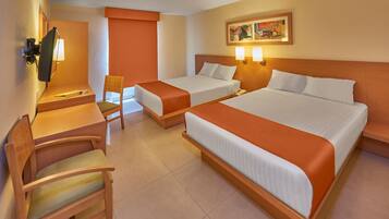 A hotel room with two beds, a desk, a chair, and a television.