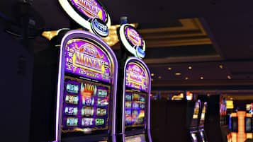 Experience the excitement of the casino floor, where slot machines offer a variety of games and denominations.