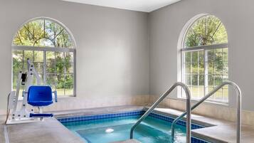 Indoor pool, a heated pool, open 7:00 AM to 11:00 PM, pool loungers
