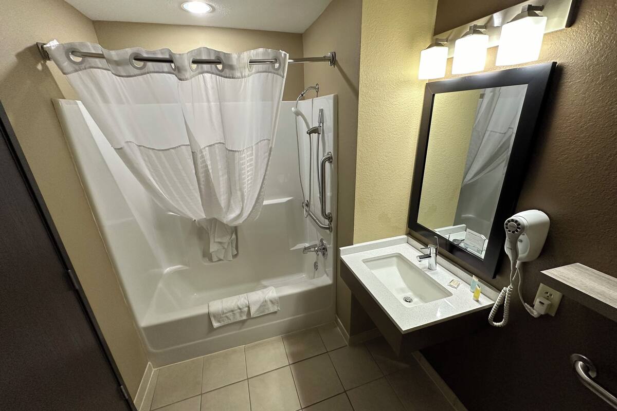 combined shower/bathtub, hair dryer, towels, soap