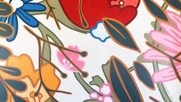 A colorful floral pattern with a variety of shapes and colors.