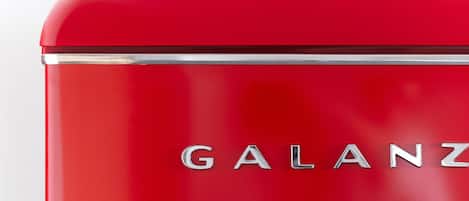 A red vintage suitcase with the brand name "GALANZ" visible on the side.