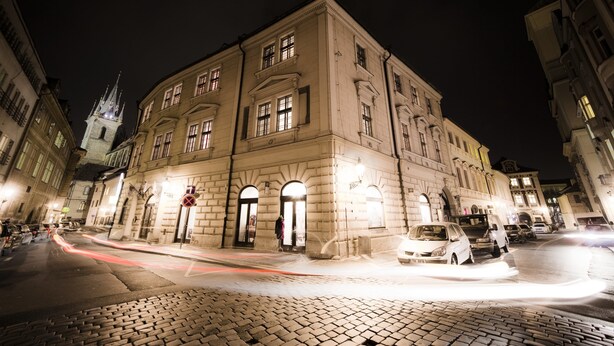 A historic building with classical architecture, large windows, and a prominent entrance. - Royal Residence Ungelt (Prague)