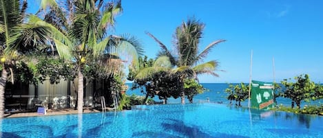 Outdoor pool, pool umbrellas, sun loungers