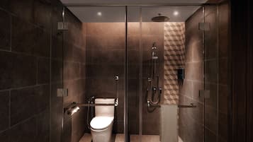 A modern bathroom with a glass-enclosed shower, a toilet, and a towel rack.
