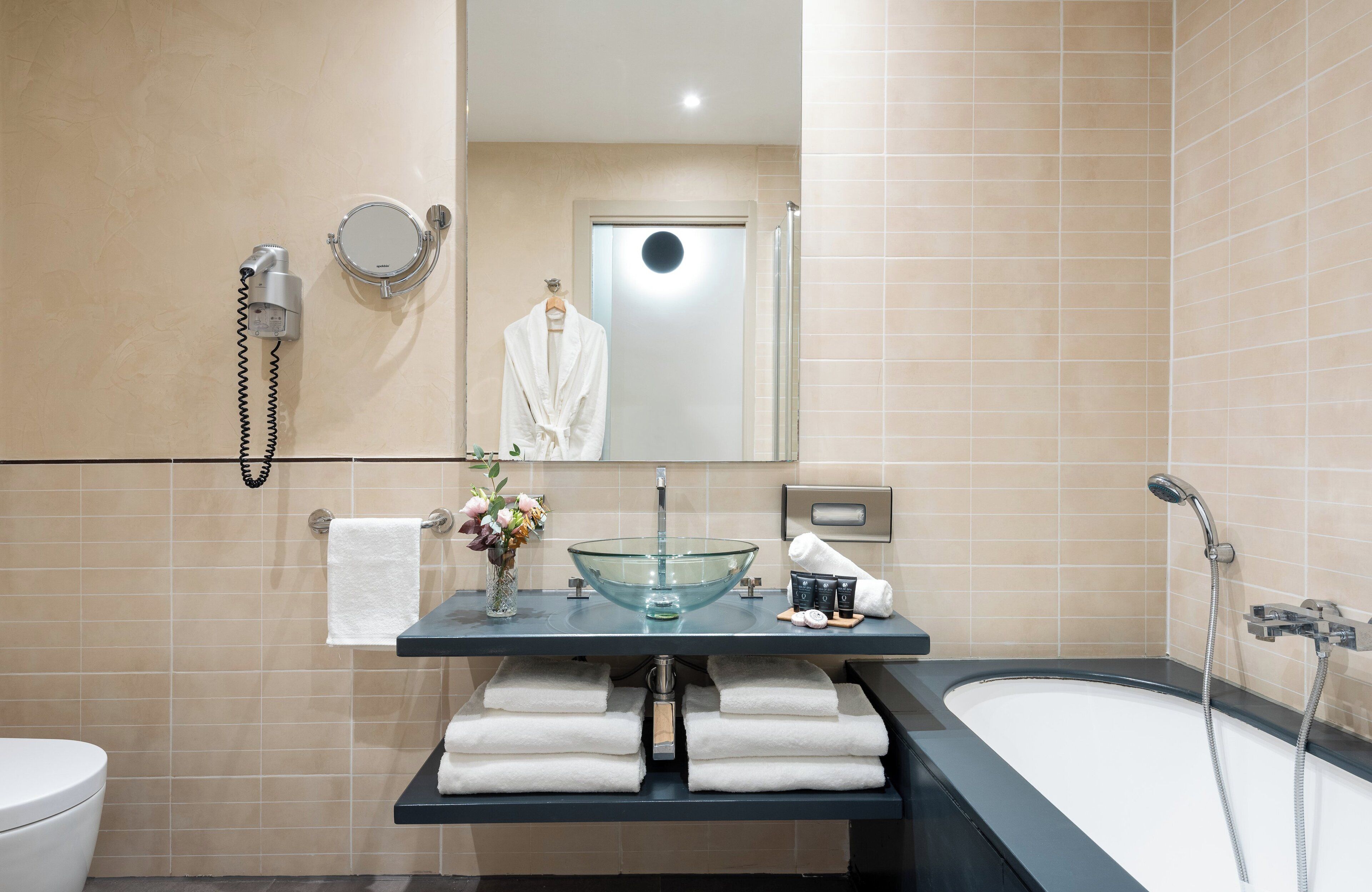 family room | bathroom | free toiletries, hair dryer, slippers, bidet