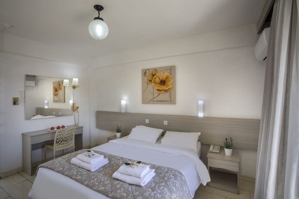Double Room | Desk, blackout drapes, cribs (free), rollaway beds