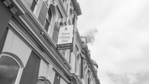A building with a sign for Victoria Railway Hotel & Garrards Restaurant. - Victoria Railway Hotel (Invercargill)