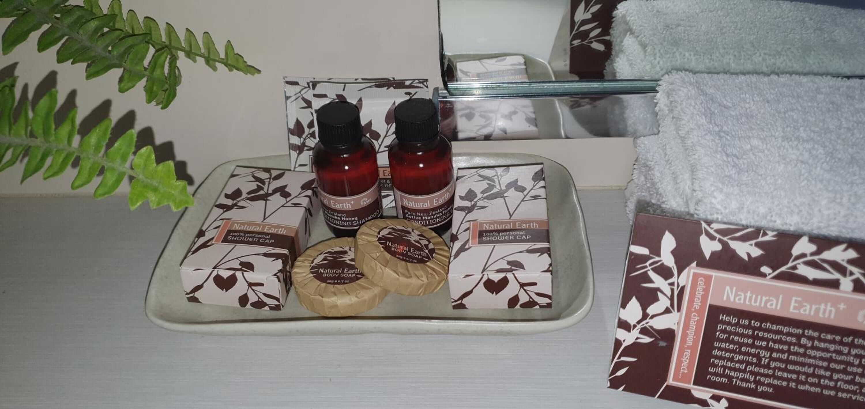 combined shower/bathtub, designer toiletries, hair dryer, towels