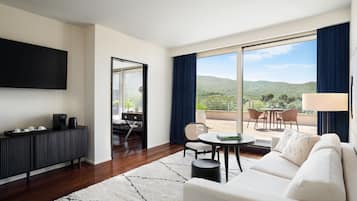 Deluxe Suite, 1 Bedroom, Golf View | Living room | 55-inch flat-screen TV with satellite channels, TV, pay movies