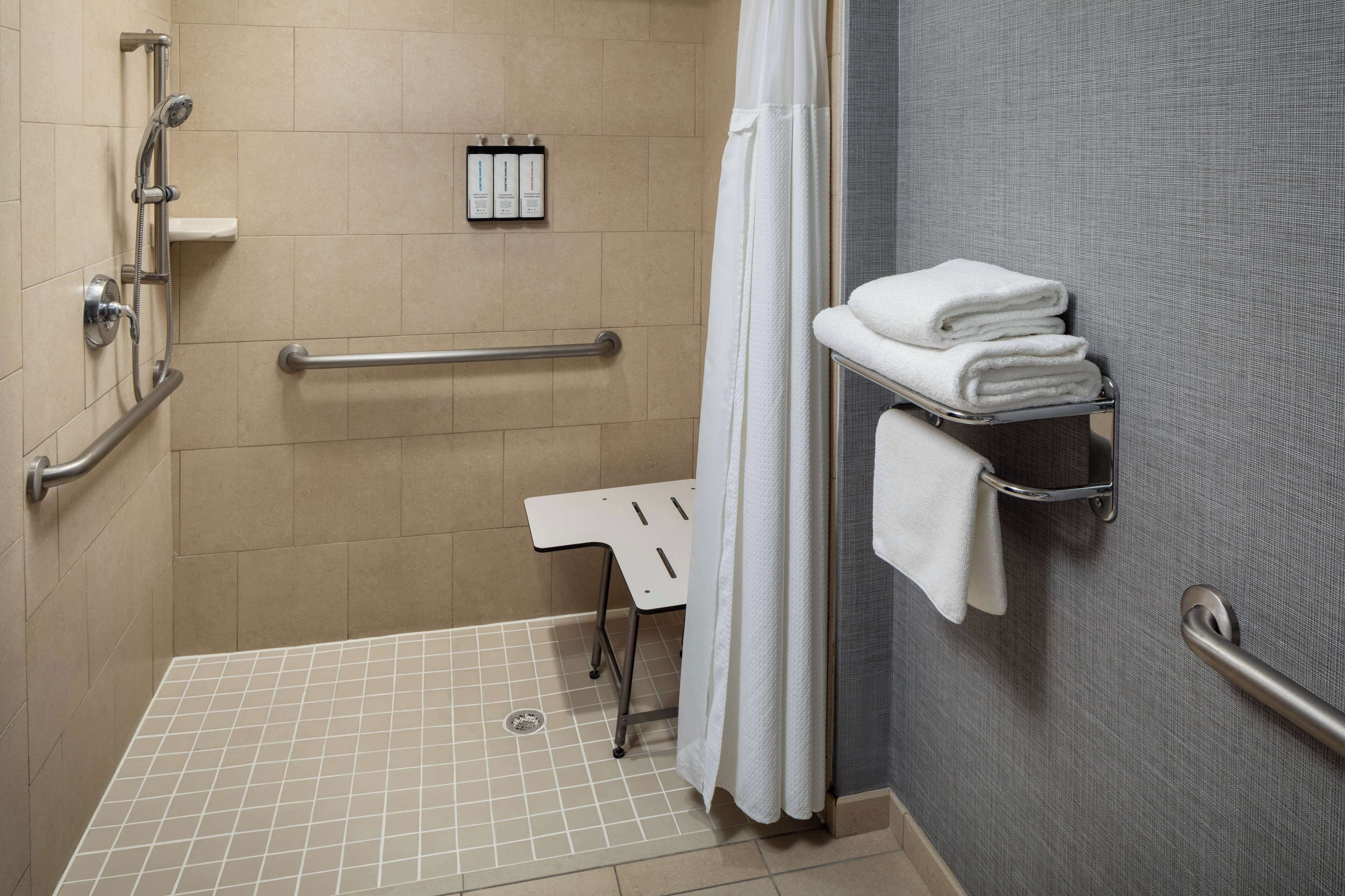 rainfall showerhead, designer toiletries, hair dryer, towels